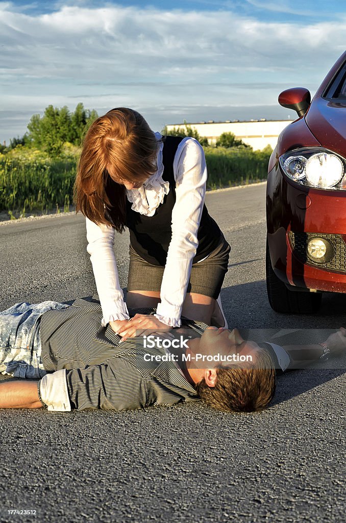 Young man reanimation on a road. Concept first aid Adult Stock Photo