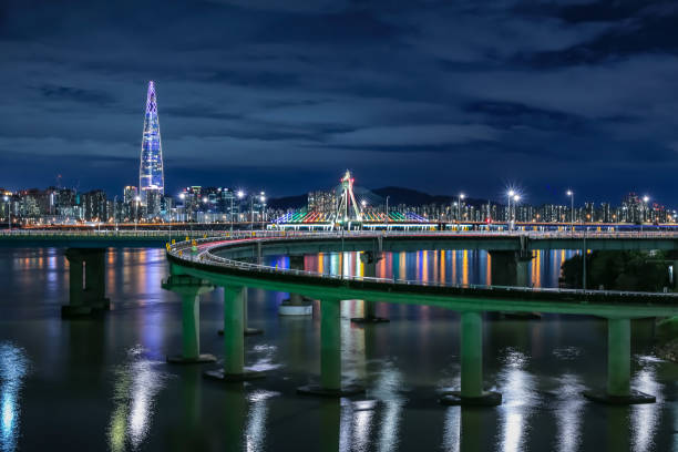 It's the night view of the Han River with the Olympic Bridge and the 2nd Lotte World Tower