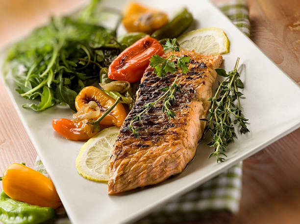 istock grilled salmon with capsicum and arugula 177424206