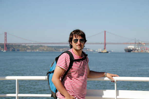 Tourist on the 25th of April Bridge in Lisbon, Portugal