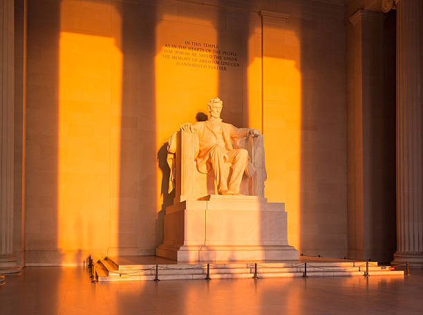 istock Sun at dawn illuminates Lincoln statue 177424929