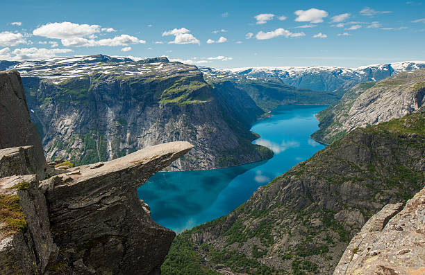 Trolltunga, Troll's tongue rock, Norway "Trolltunga, Troll's tongue rock above lake Ringedalsvatnet, Norway" fjord photos stock pictures, royalty-free photos & images