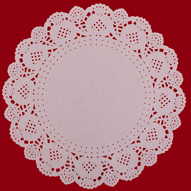 istock Paper doily lacy background, over red 177425666