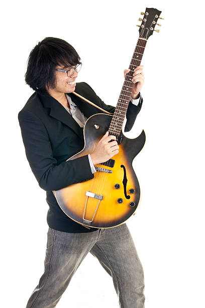istock Asian young musician playing guitar 177425779
