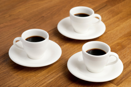 Three coffee cups on the table.