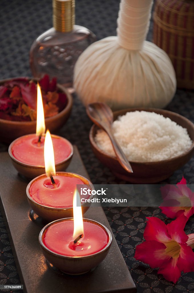 Spa Candles Tranquil scene of candles and spa accessories. Dark Stock Photo