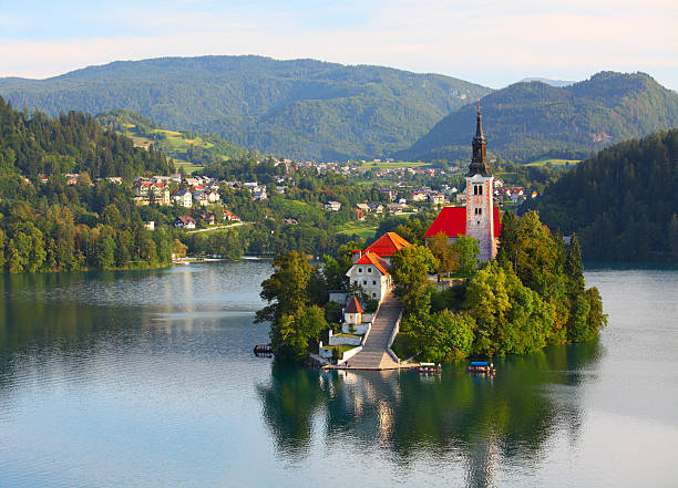 Santa Maria Church on Bled lake Santa Maria Church catholic church situated on an island on Bled lake with mountains and villages on the background gorenjska stock pictures, royalty-free photos & images