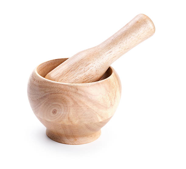 istock Wooden mortar and pestle isolated on white 177427088