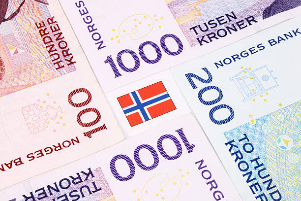 Norwegian Bank Notes &  Flag A closeup of Norwegain currency bank notes. dealing room photos stock pictures, royalty-free photos & images