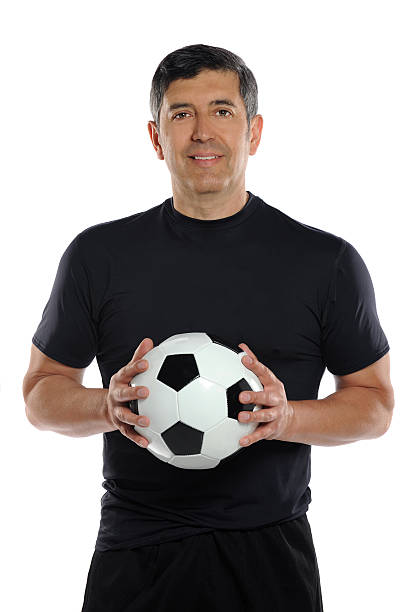 istock Man Holding Soccer Ball 177427550
