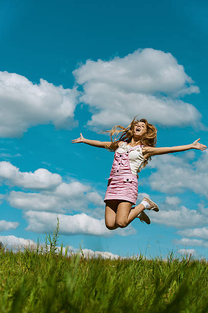 istock young woman close-up jumping 177427669