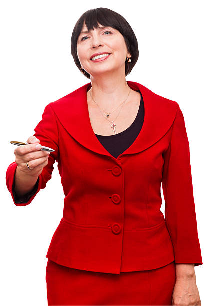Mature business woman with pen in her hand stock photo