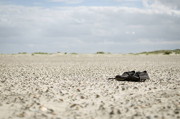 istock Shoes at the shore 177428386