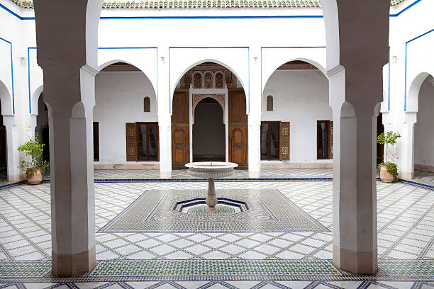 Courtyard in Bahia Palace Marrakech Morocco "Marrakech, Morocco - March 31, 2012: Courtyard with mosaic and fountain on the floor in Palais de la Bahia." courtyard photos stock pictures, royalty-free photos & images