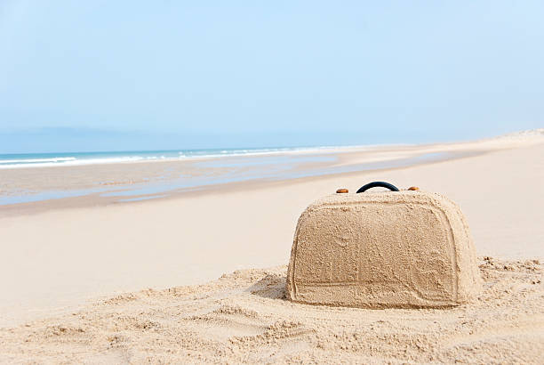 istock Suitcase made out of sand on beach 177428878