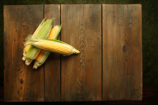 Corn  at a  picnic table background.