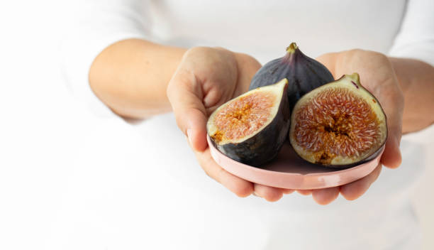 istock Woman Showing Fresh Figs 1774290002