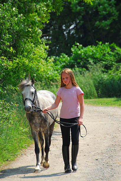 Girl walk pony