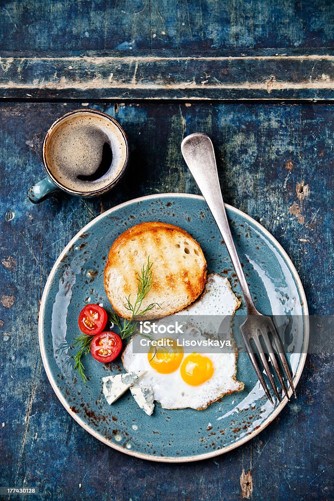 Eggs with coffee Traditional breakfast eggs with coffee Blue Stock Photo