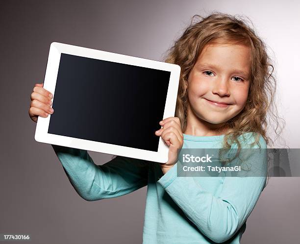 Happy Girl With Tablet Computer Stock Photo - Download Image Now - Digital Tablet, Child, Holding