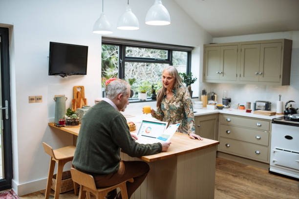 istock Married mature couple using banking app at home and paying online. Seniors using secure internet protocol for fraud prevention 1774302610