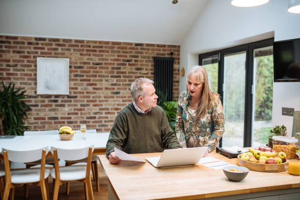 istock Senior couple using online payment website at home and paying online. Seniors using secure internet protocol for fraud prevention 1774303720