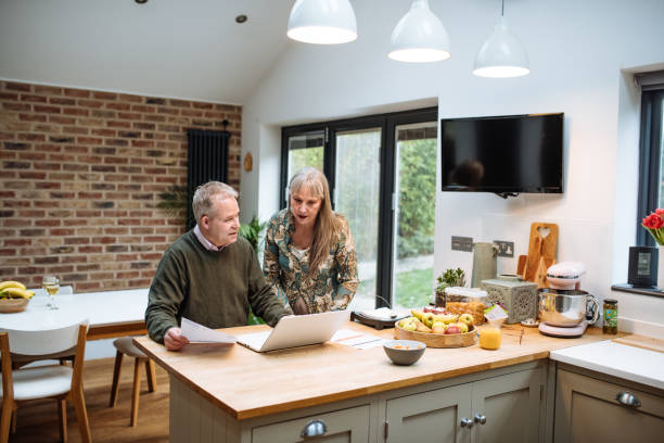 istock Senior couple using online payment website at home and paying online. Seniors using secure internet protocol for fraud prevention 1774304799