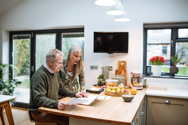 istock Senior couple using online payment website at home and paying online. Seniors using secure internet protocol for fraud prevention 1774305290