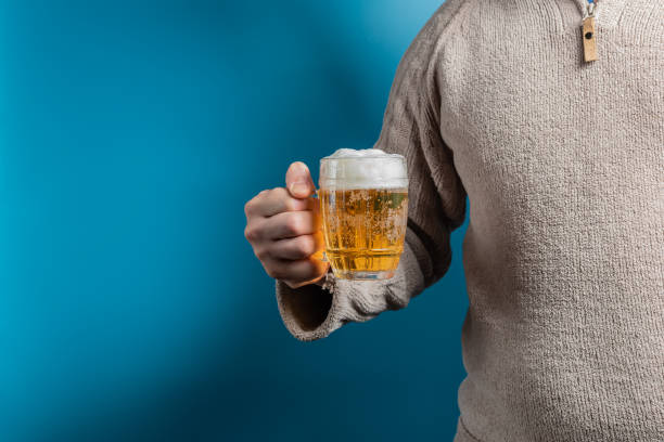 istock A man holding a filled glass of light beer 1774310139