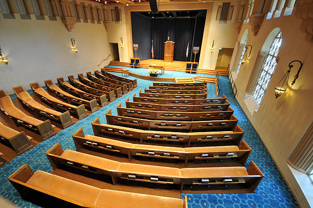 Rows of pews in a synagogue stock photo