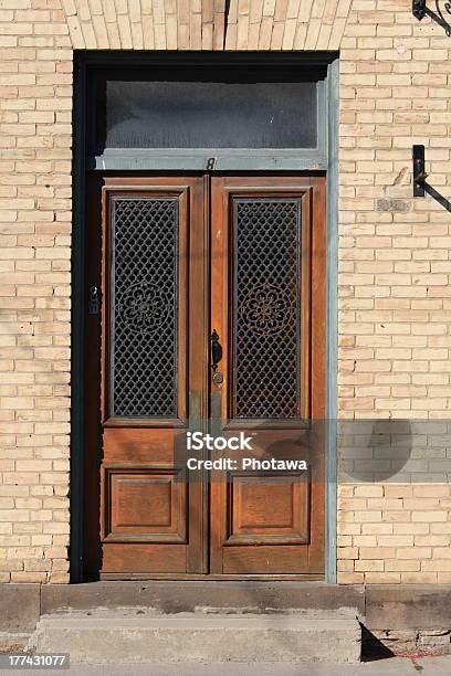 Double Wooden Doors In Brick Building Stock Photo - Download Image Now - Architectural Feature, Architecture, Beige