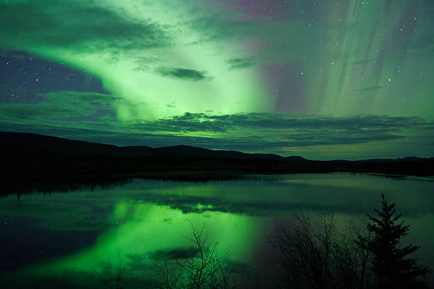 istock Night Sky Stars Clouds Northern Lights mirrored 177431778