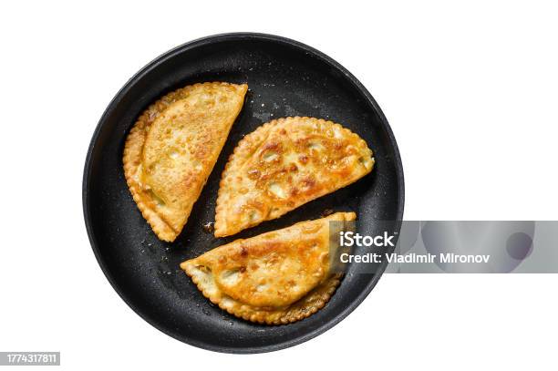 Homemade Fried Chebureks With Meat And Herbs In A Pan Traditional Caucasian Cuisine Isolated On White Background Stock Photo - Download Image Now