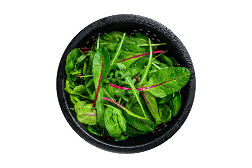 Fresh raw mixed greens, spinach, swiss chard and arugula. Isolated on white background