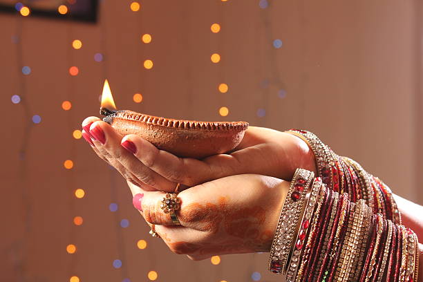 Diwali oil lamp in female hand