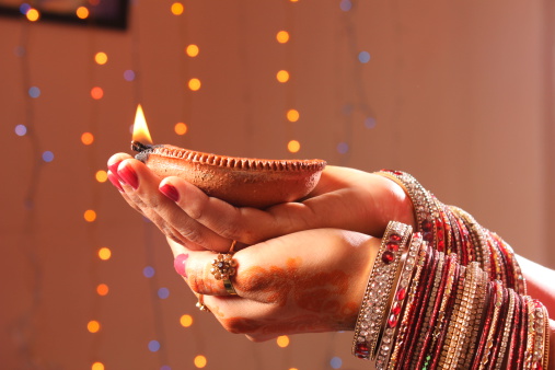 Diwali oil lamp in female hand