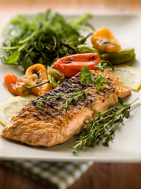 istock grilled salmon with capsicum and arugula 177432144