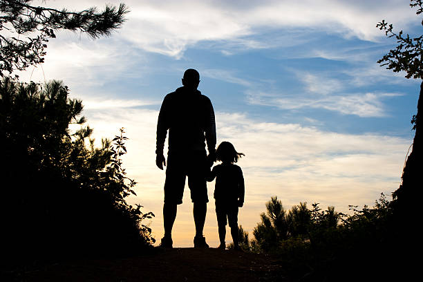 istock father and daughter silhouette 177432179