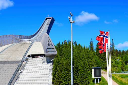 New Holmenkollen ski jump in Oslo Norway summer time with flag