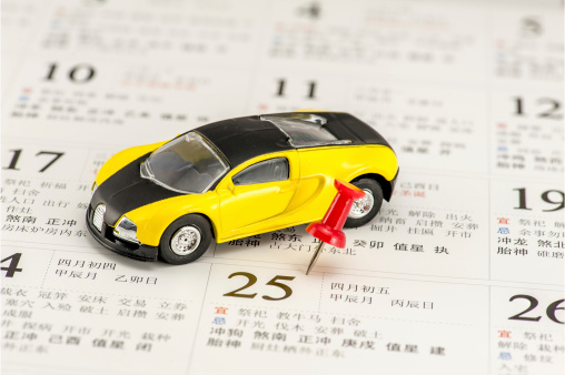 Yellow car model and a red pushpin on Chinese calendarPlease see other similar pictures from my portfolio: