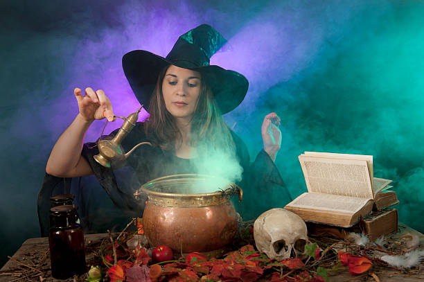 istock Halloween witch on smoke green and purple background 177433802