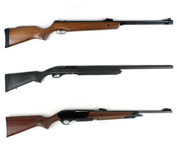 Hunting rifles - modern rifles and modern shotgun isolated on white background