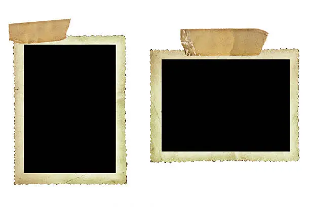 "Vintage photo borders fastened with old sticky tape, isolated on white."