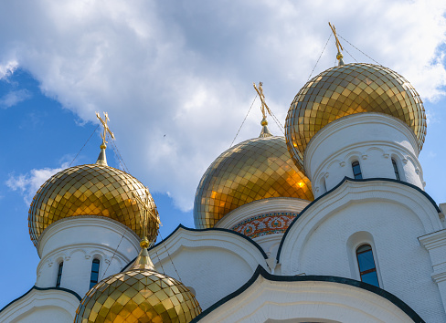 Domes of the Assumption Cathedral in Yaroslavl against the blue sky