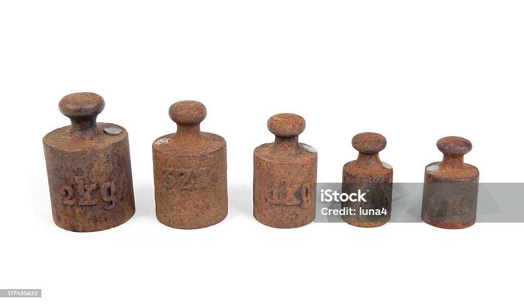 rusty weights rusty weights against white background Accuracy Stock Photo