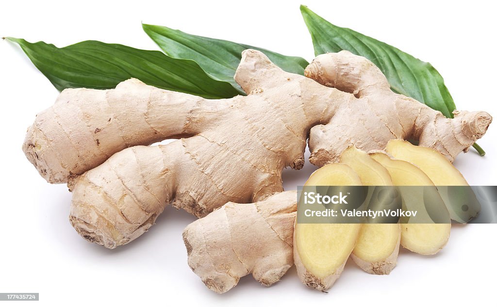 Fresh ginger with leaves isolated on white background. Close To Stock Photo