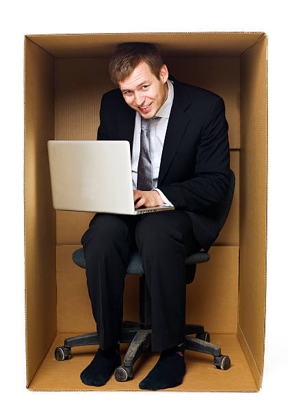 istock Businessman in a tight office 177436528