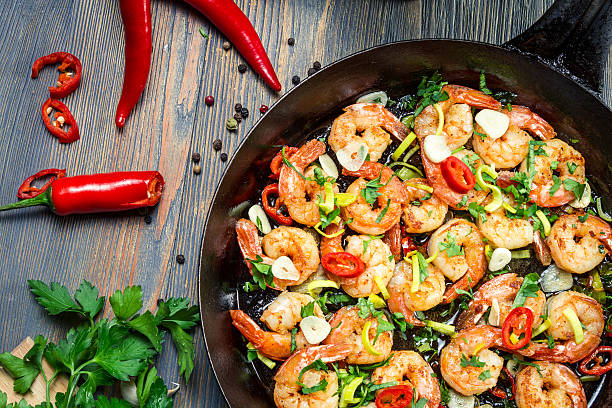 istock Shrimps fried on pan with fresh herbs 177438534
