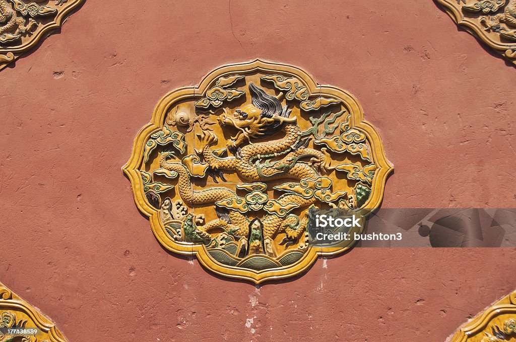 Dragon wall decoration, Forbidden City, Beijing "The dragon is a common symbol in Chinese culture, often symbolising power. Here, a ceramic dragon design is featured on an exterior wall in the Forbidden City, Beijing." Abstract Stock Photo