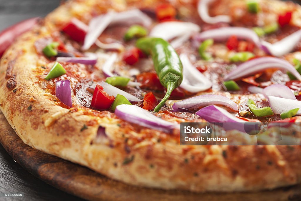 Hot chili pizzawith onion "Tradition Mexican pizza with chili, salami and onion" Baked Stock Photo